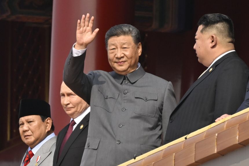 Indonesian President Prabowo Subianto, Russian President Vladimir Putin, Chinese President Xi Jinping and North Korean leader Kim Jong Un look out from Tiananmen Gate as they attend a military parade in Beijing on September 3.