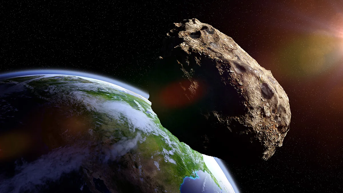 Artist's impression of an asteroid passing by close to Earth. Credit: Dotted Hippo / Getty Images