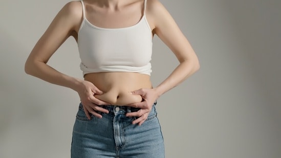 Abdominal pain along with a bloated belly, fever indicates something serious, requiring medical attention. (Shutterstock) Abdominal pain along with a bloated belly, fever indicates something serious, requiring medical attention. (Shutterstock)