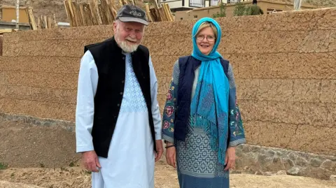 Handout Barbie and Peter Reynolds pose for a picture in Afghanistan