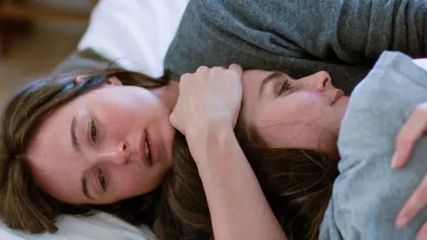Mubi Two young women, one embracing the other