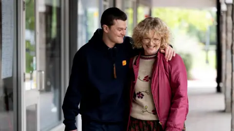 Studio Canal A still from the film of John and a woman in the street