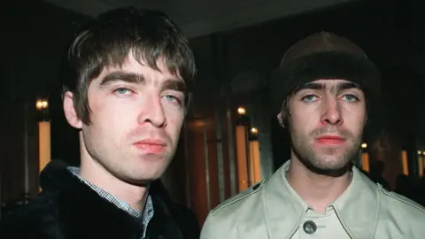 PA Media Noel Gallagher (left) and Liam in 1996