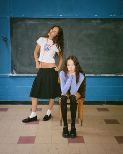 two models in Danielle Guizio's eponymous label collaboration with K-pop girl group Le Sserafim 