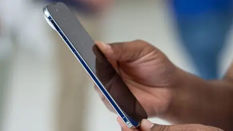 Getty Images A person holding the Apple iPhone Air