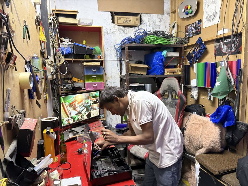 A joystick is repaired at the Maniax arcade.