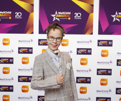 ansel holding is award and smiling