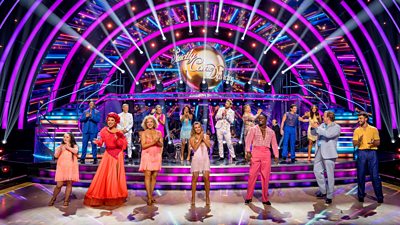 The Strictly Come Dancing 2025 celebrities stand on the ballroom floor together smiling and clapping