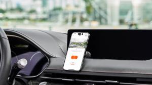 SAFY 9 App on smartphone hanging on the dash of a car