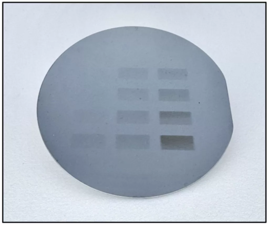A silicon wafer coated with a radiation-sensitive material