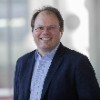 Neuromorphic computing pathways to intelligent innovation