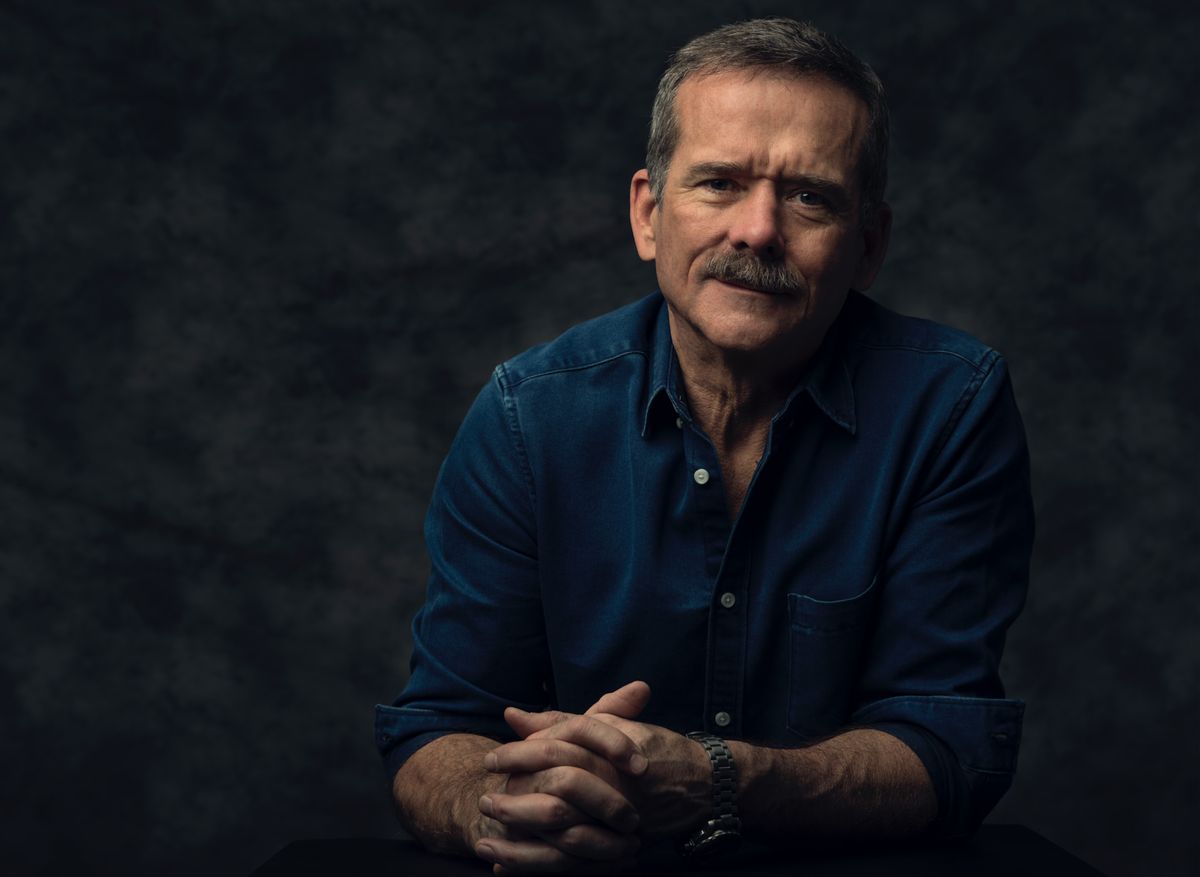 an author portrait head shot of a man with a mustache