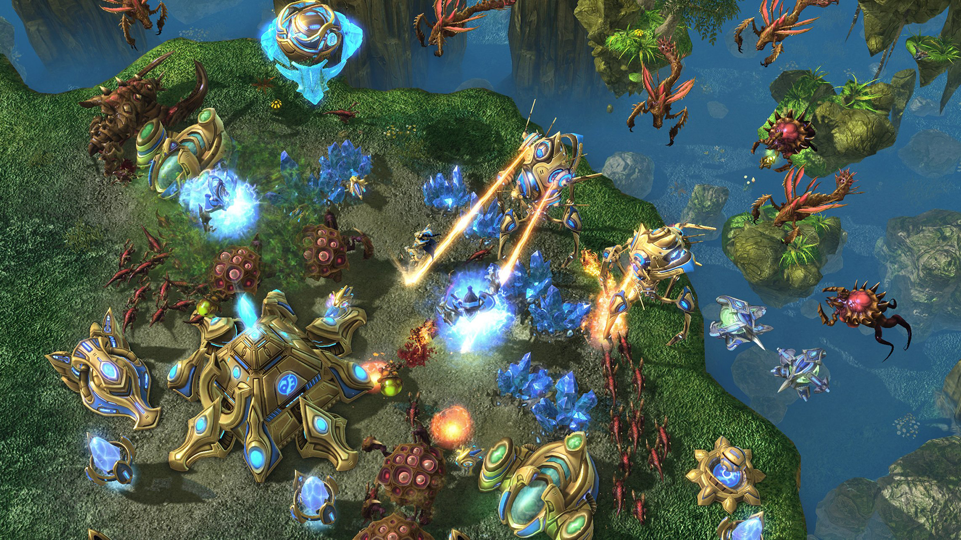 Still from the video game StarCraft 2. Two large, technologically advanced vehicles are protecting their base from flying alien invaders.