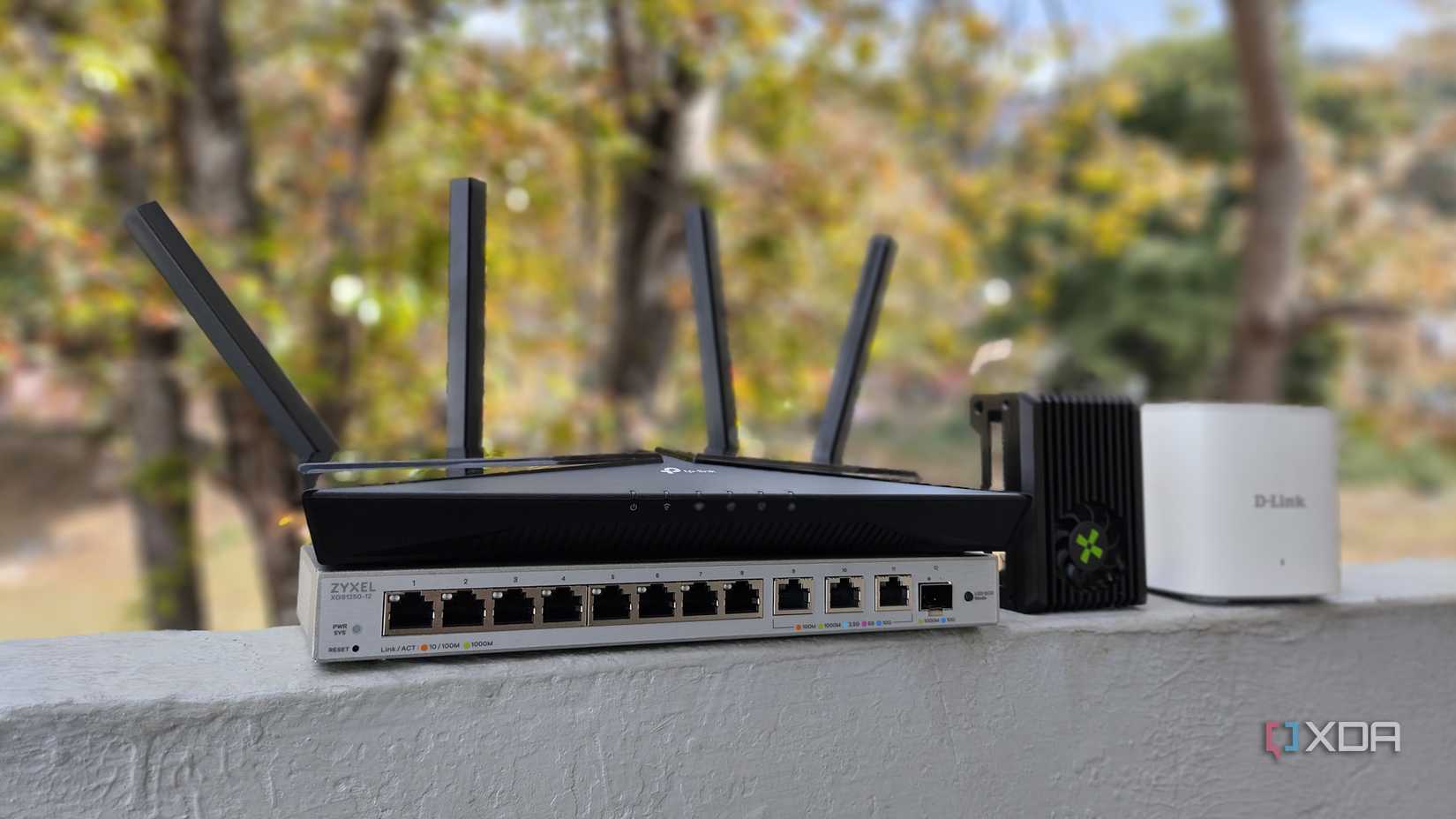A TP Link router, Radxa X4 SBC, D-Link mesh router, and Zyxel Switch