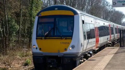 Getty Images Transport for Wales train seen from the front at platform with trees on the other side