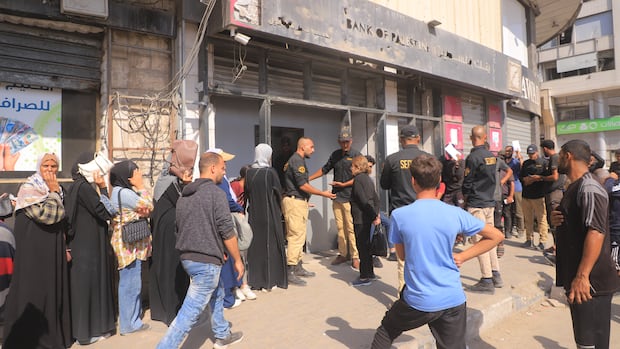 2 bank branches partially reopen in Gaza — without cash