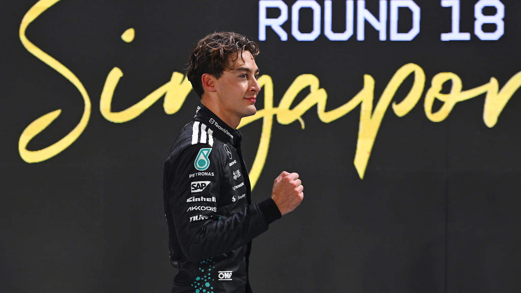 George Russell takes his first Singapore Grand Prix pole in a new track record