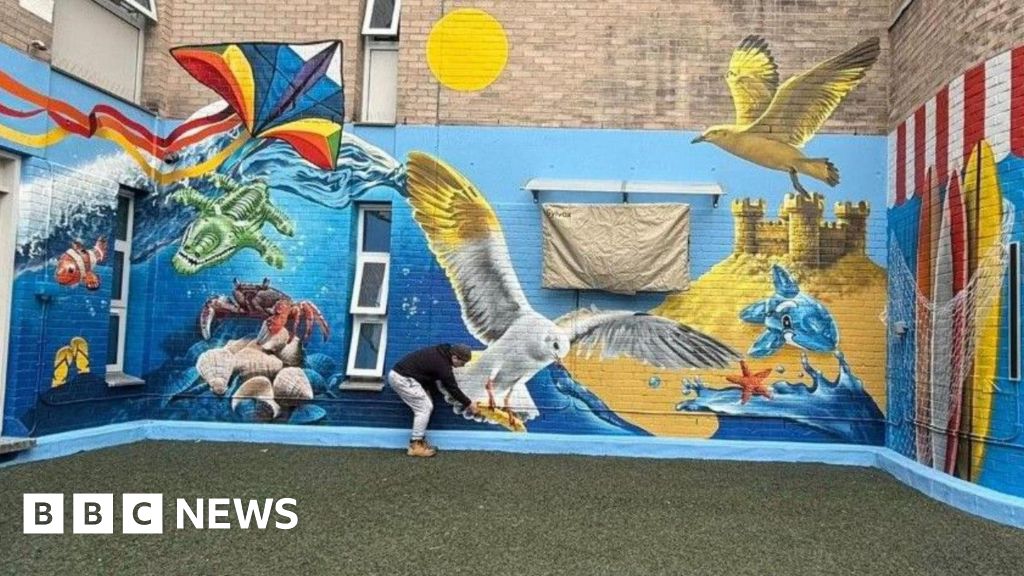 Artist fundraised to gift Wolverhampton hospital children’s garden mural