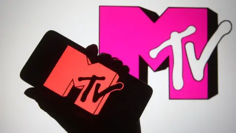 Getty Images The MTV logo is shown on a telephone, as well as being projected on a TV screen