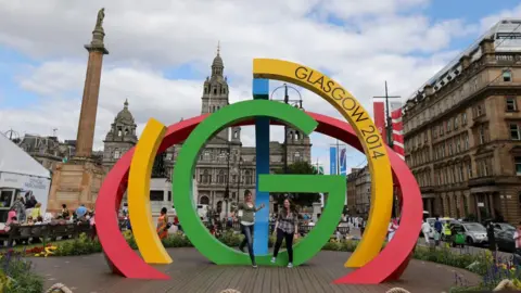 Getty Images Visitors  climb on the Big G sculpture in George Square, Glasgow ahead of the Commonwealth Games 2014 