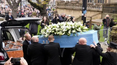 PA Media The coffin of Ricky Hatton is carried out of Manchester Cathedral. 