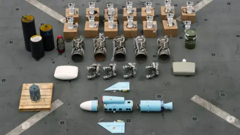 US Department of Justice An image of weapons components laid out on a concrete floor, after being seized from Muhammad Pahlawan's boat.
