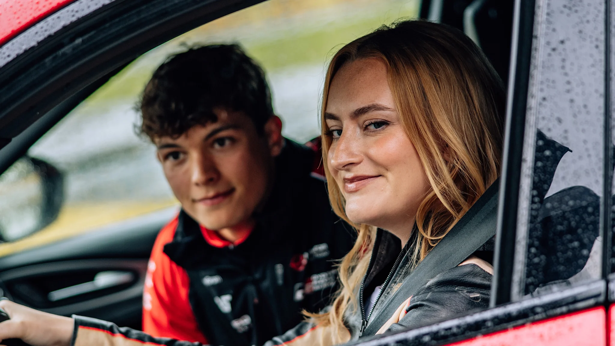 Ollie Bearman teaches ‘Chicken Shop Date’ star Amelia Dimoldenberg how to drive in ‘Passenger Princess’