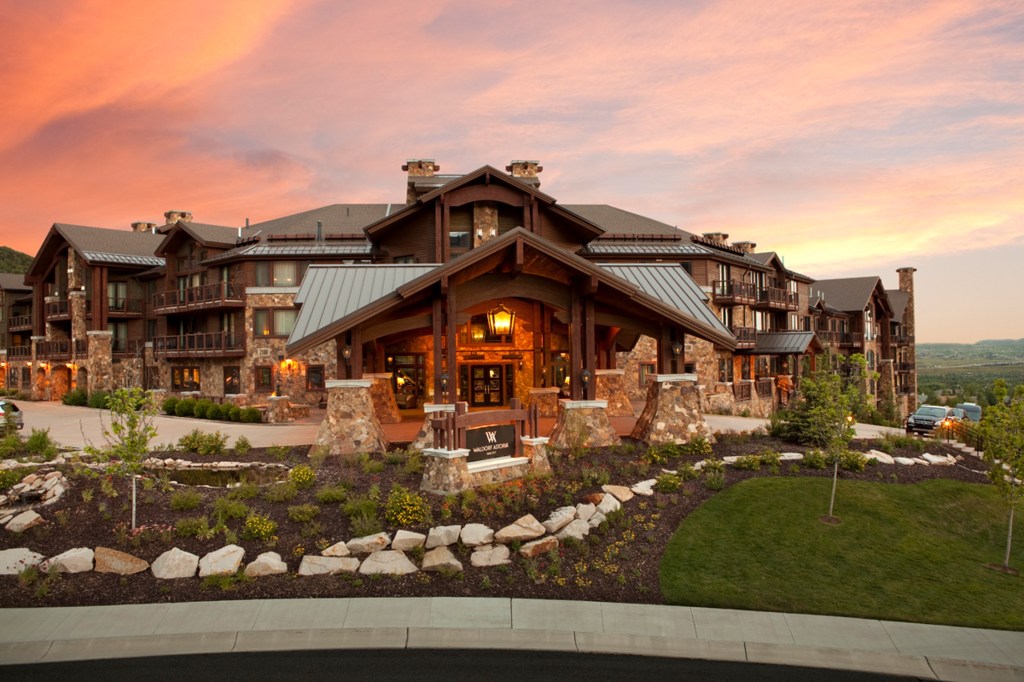 Exterior of Waldorf Astoria Park City at sunset