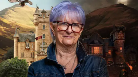 BBC/Studio Lambert A promo shot of Linda with the Traitors castle behind her. Part of it is a daytime scene, and part is at night.