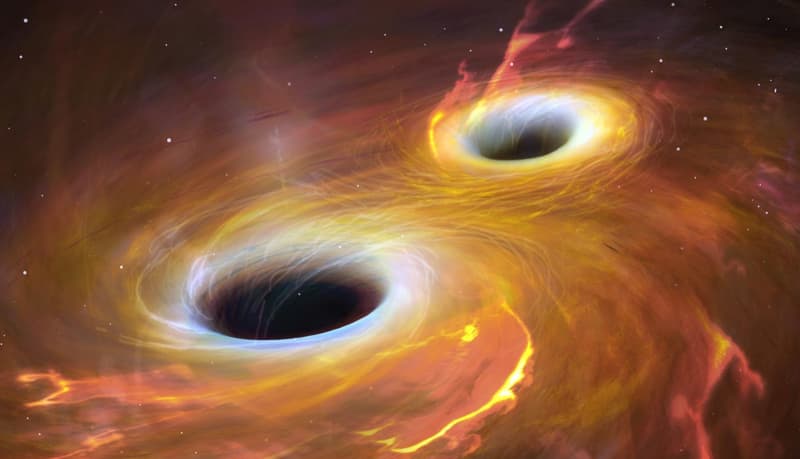Astronomers capture first-ever image of two black holes orbiting each other