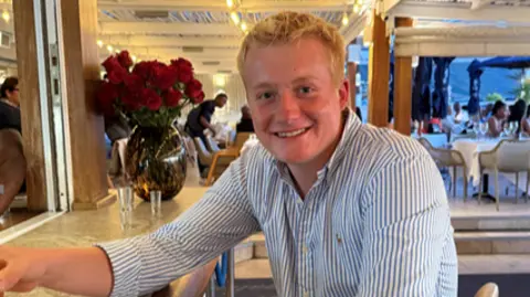 BBC Harley Pearce in a blue and white shirt