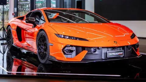 Getty A bright orange Lamborghini Temerario parked in a showroom