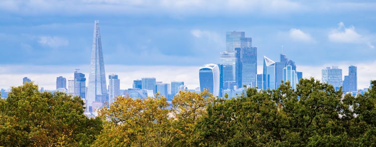 london city skyline with green trees