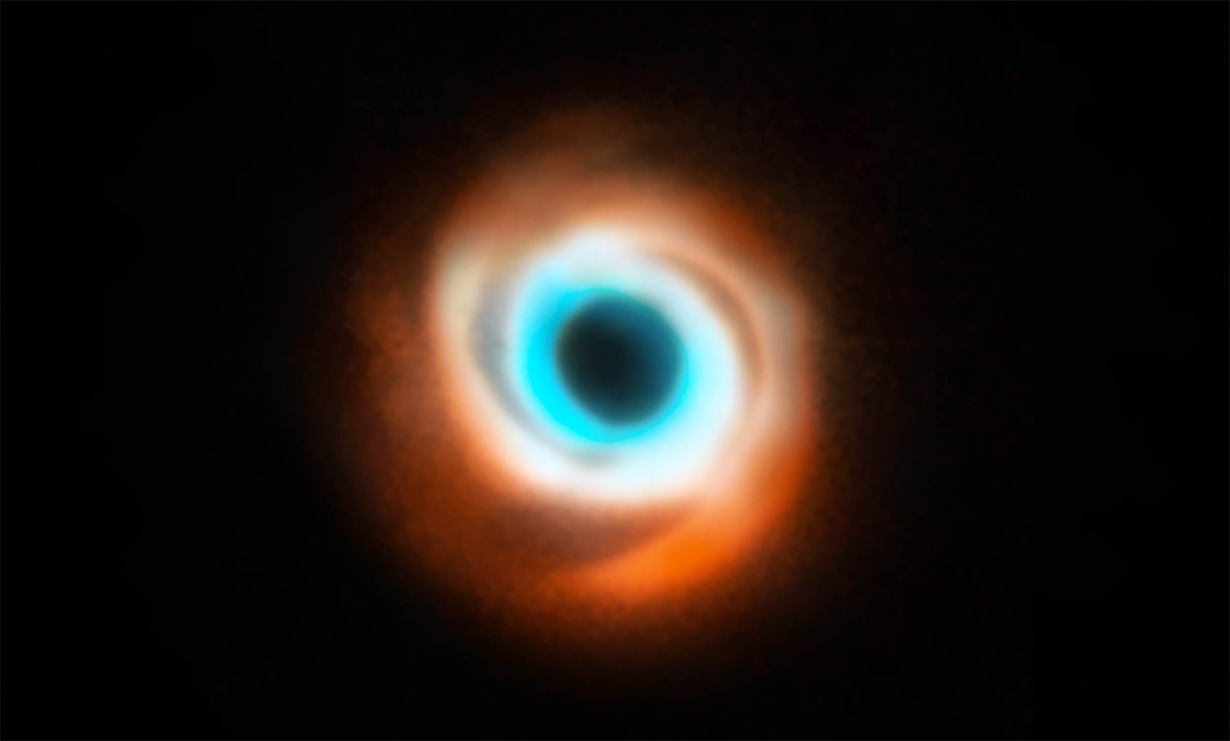 Seeing a newborn planet sculpting its dust disk for the first time