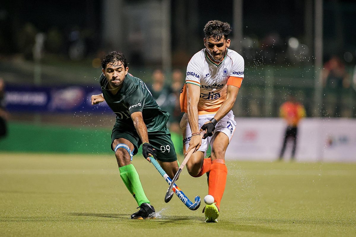 Indian hockey team players exchange pleasantries with counterparts from Pakistan