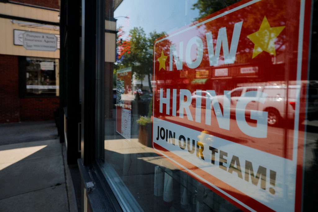 Weekly unemployment filings drop in a sign that layoffs continue to stay low
