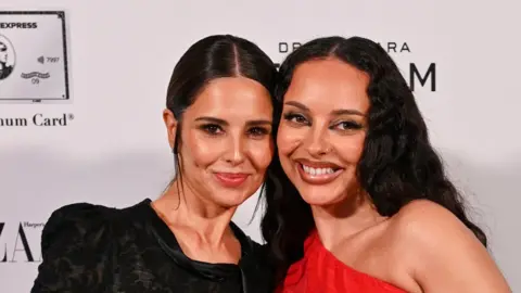 Getty Images  Cheryl and Jade Thirlwall, winner of the Musician award, pose in the winners room at the 2025 Harper's Bazaar Women of the Year Award