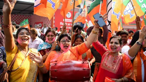 Reuters Bharatiya Janata Party (BJP) supporters celebrate as early trends show the ruling National Democratic Alliance leading in the Bihar state assembly election results, in Patna, India, November 14, 2025. REUTERS/Sonu Kishan TPX IMAGES OF THE DAY
