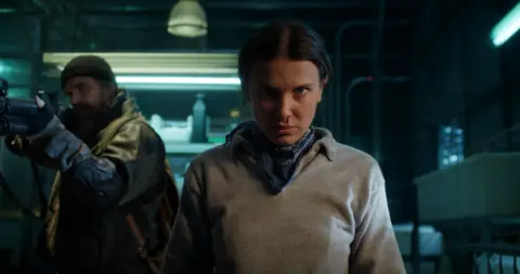 Netflix (L to R) David Harbour as Jim Hopper and Millie Bobby Brown as Eleven in Stranger Things.