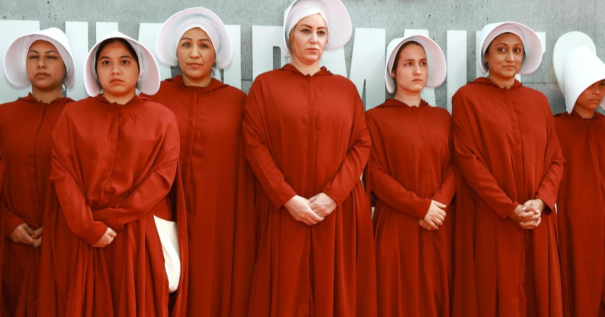 What inspired the outfits in Margaret Atwood’s “The Handmaid’s Tale”