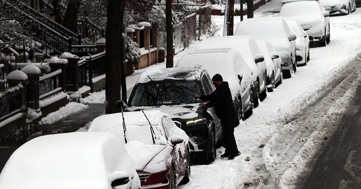 Winter storm brings heavy snow and ice to busy holiday travel weekend