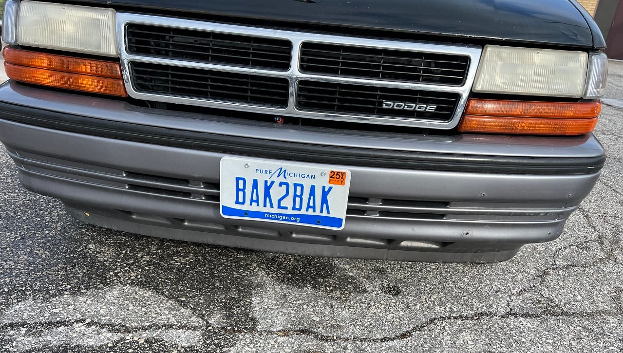 A licence plate for the state of Michigan that says bak2bak
