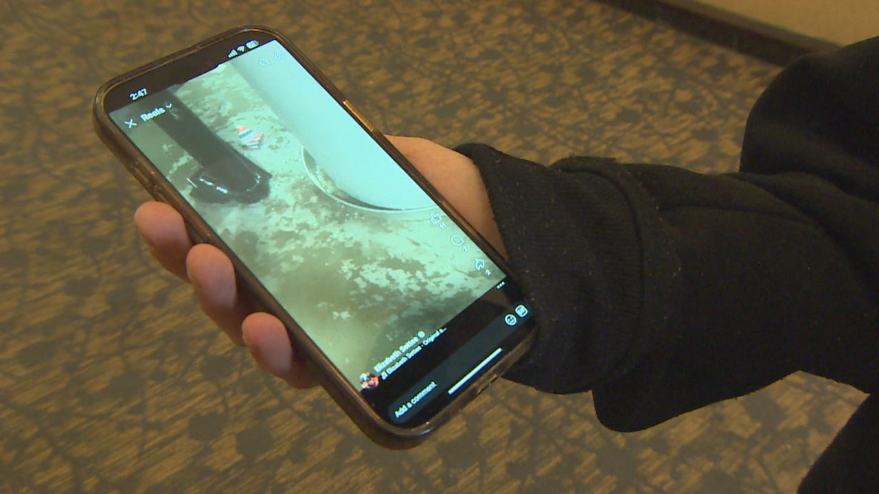 A person holds a phone.