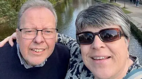 Dawn D'Auvin Dawn D'Auvin is pictured with her arms around her husband during a walk along a canal