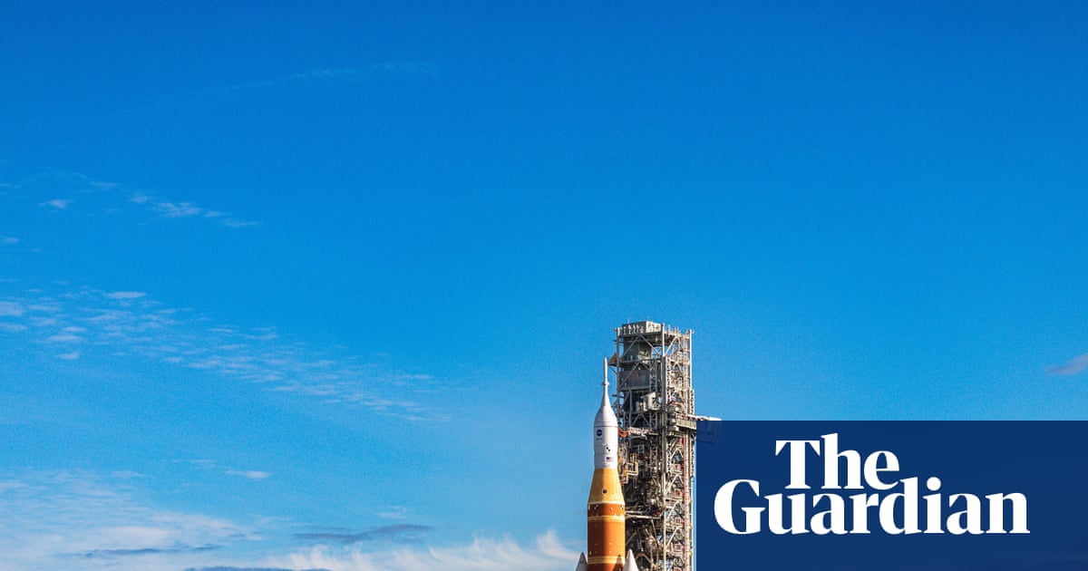 Nasa moon rocket creeps to its launchpad in preparation for astronaut flight | Nasa