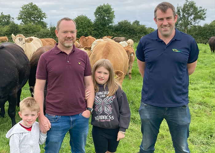 Aidan Shane and Evelyn O'Connor are pictured in front of their herd of cattle with Colm Murray