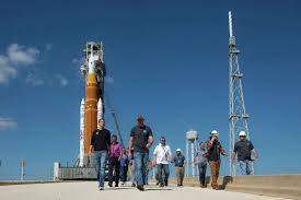 NASA rolls Moon rocket off launchpad for repairs